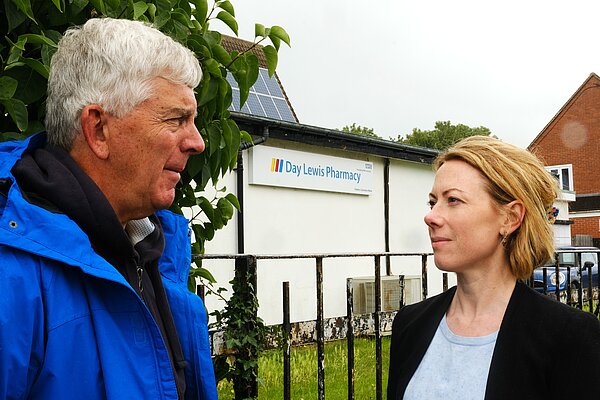 Charlotte talking to local resident outside Day Lewis Pharmacy